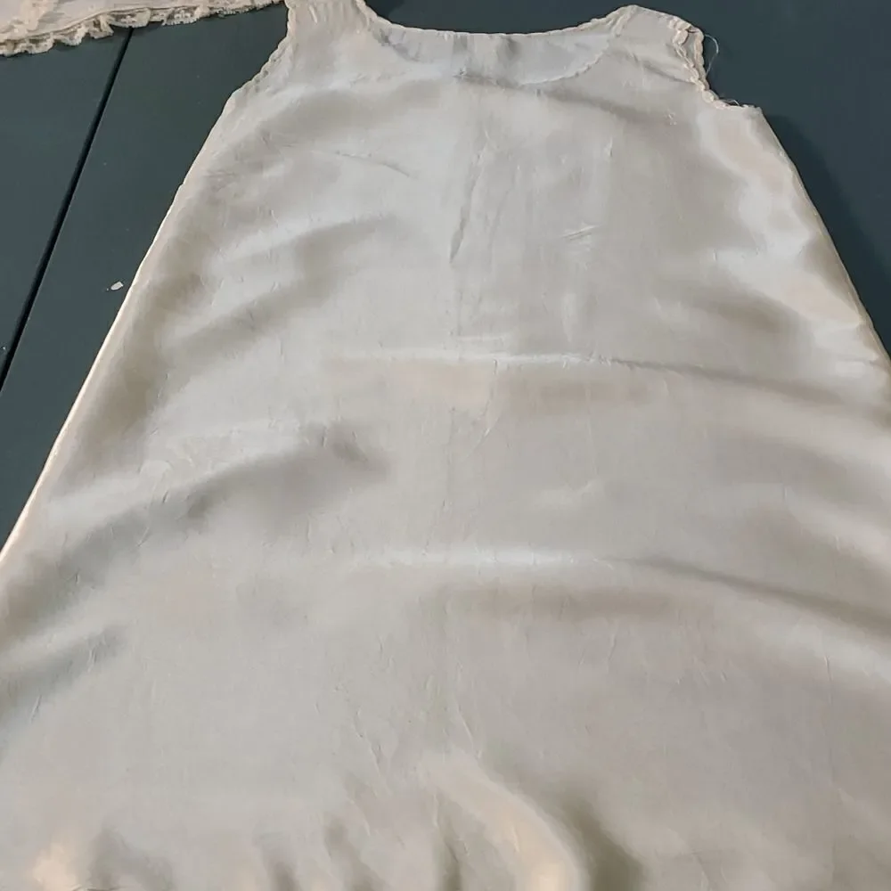 Vintage baby dress with jacket. Trimmed in lace with tie. The jacket has enbroid